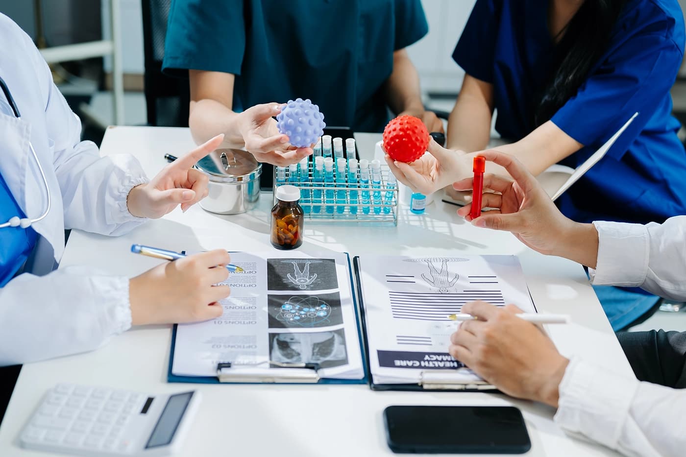Medical professionals discussing clinical programme results